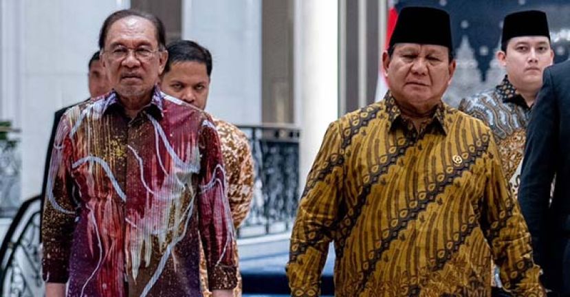 ●首相安华(左)迎接印尼总统普拉博沃的到访。   