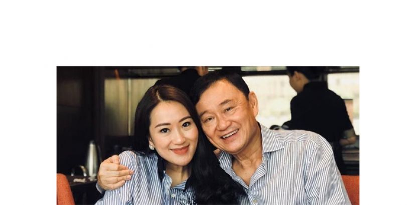 泰国前总理达辛（右）和其幼女佩通坦。