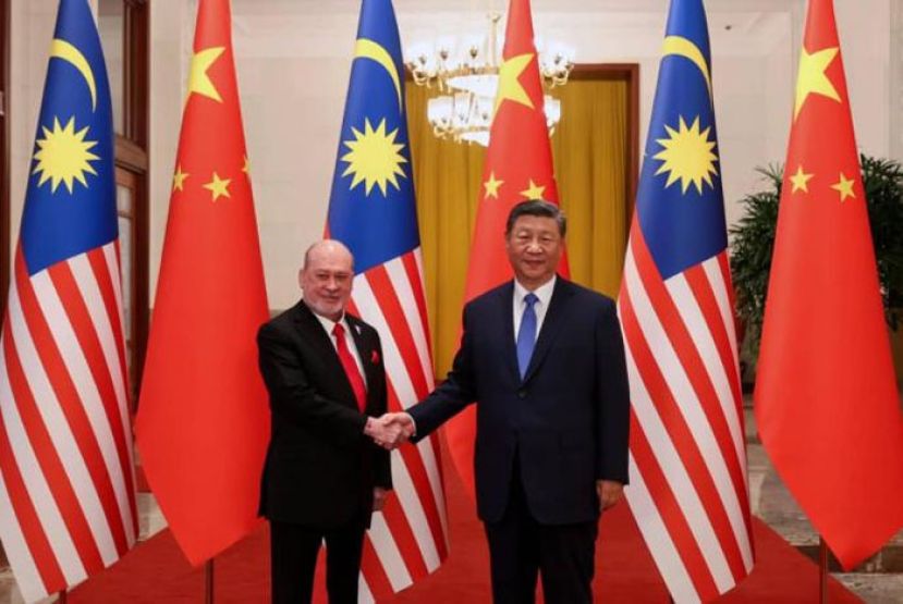 国家元首(左)今年9月访华，会晤中国国家主席习近平。