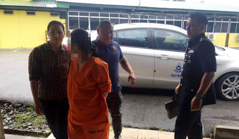 55岁华裔女嫌犯落入警网。