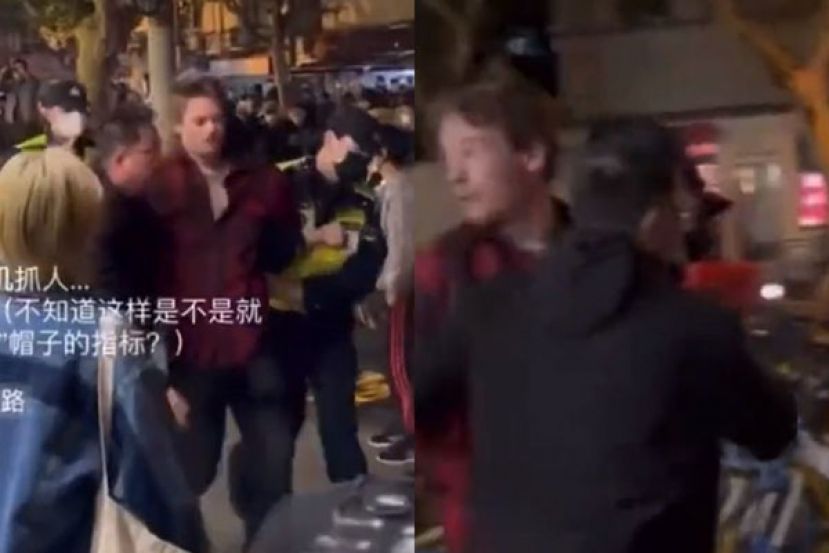 劳伦斯在上海街头被警察逮捕。